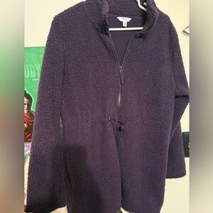 Purple fleece jacket with pockets and toggle to cinch waist; thigh length.